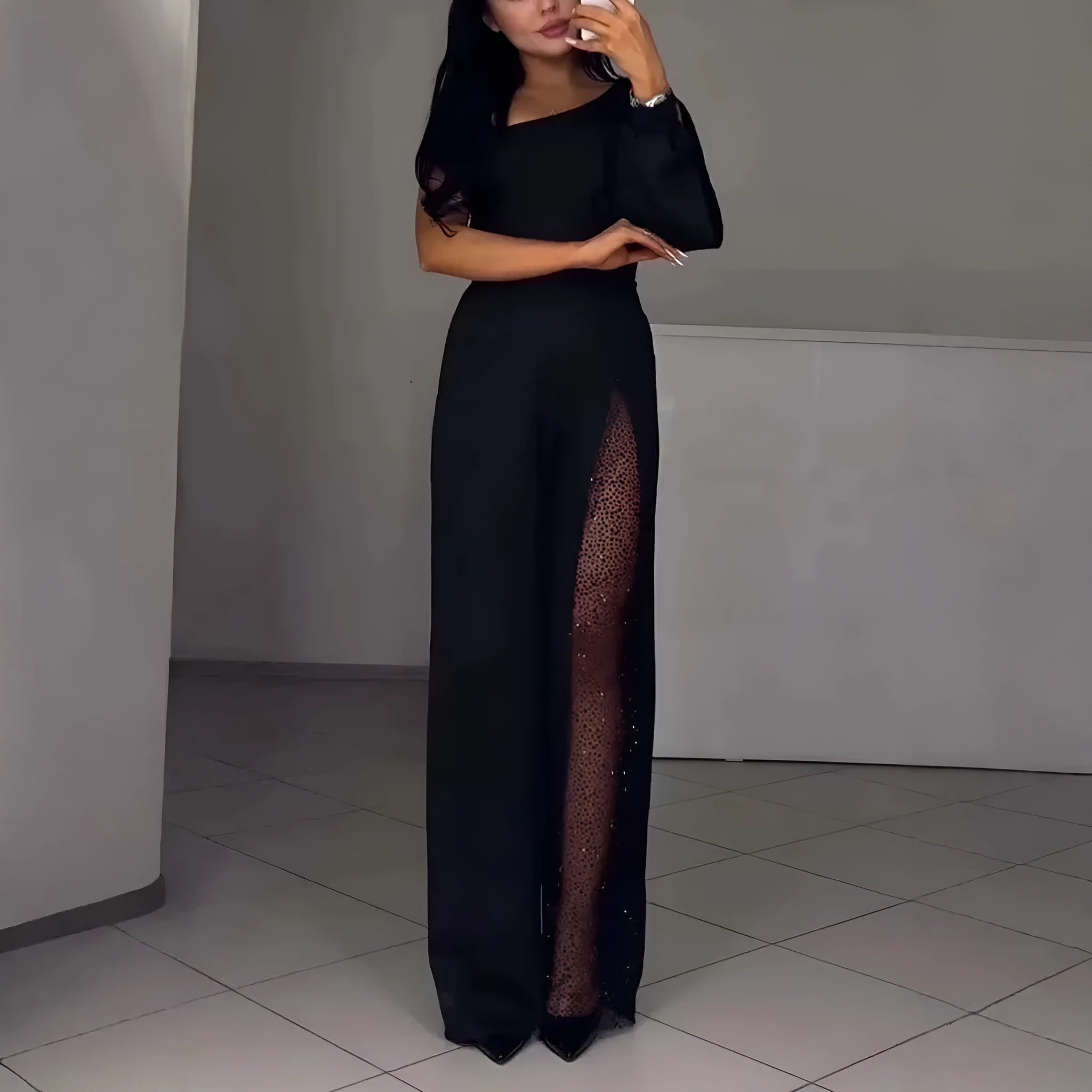 Women's black oblique shoulder jumpsuit with high slit detail and long sleeves