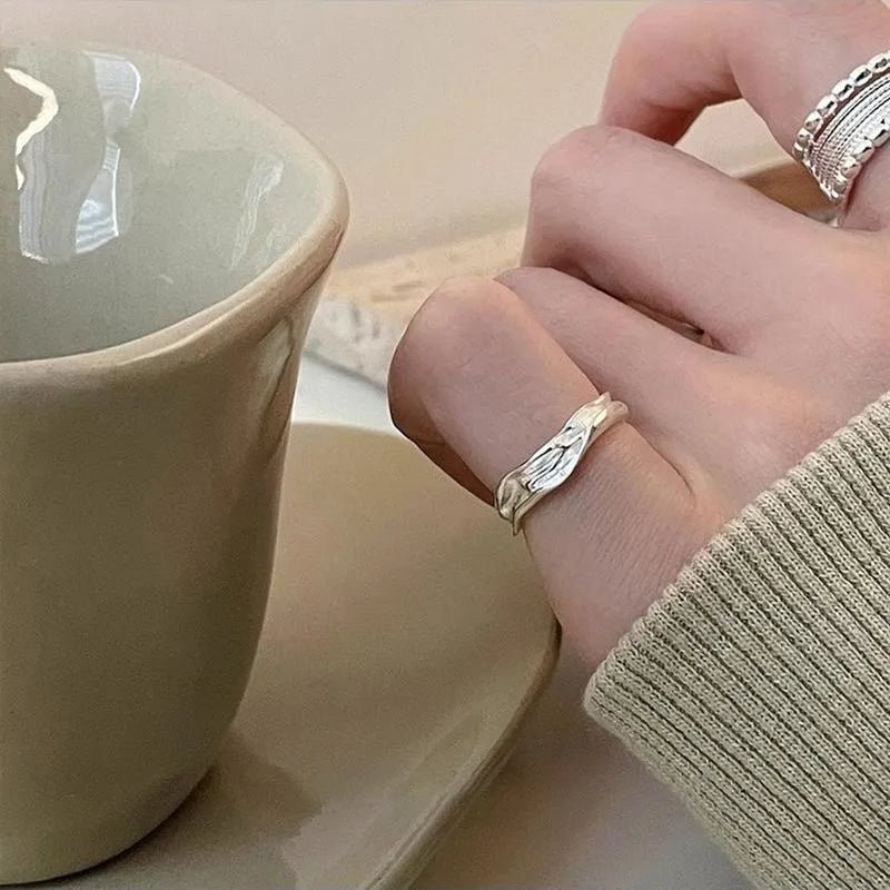 Copper alloy adjustable opening ring with woven twisted multilayer geometry design