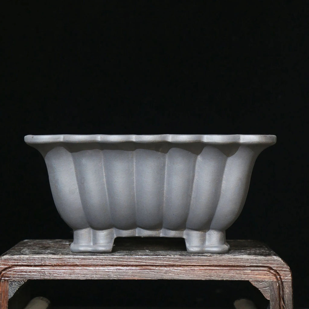 Purple sand ceramic square bonsai pot with classical design on desktop