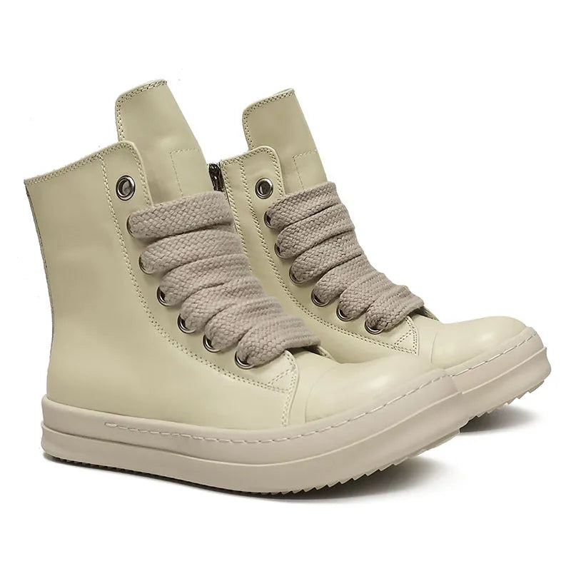 Genuine leather high-top sneakers with side zipper in black, shown on a casual outfit.
