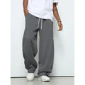 Men's solid colour casual trousers with an elastic waistband and straight leg in a grey shade.