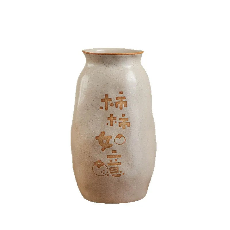 Chinese hand-painted ceramic vase with persimmon fruit designs on wooden desktop