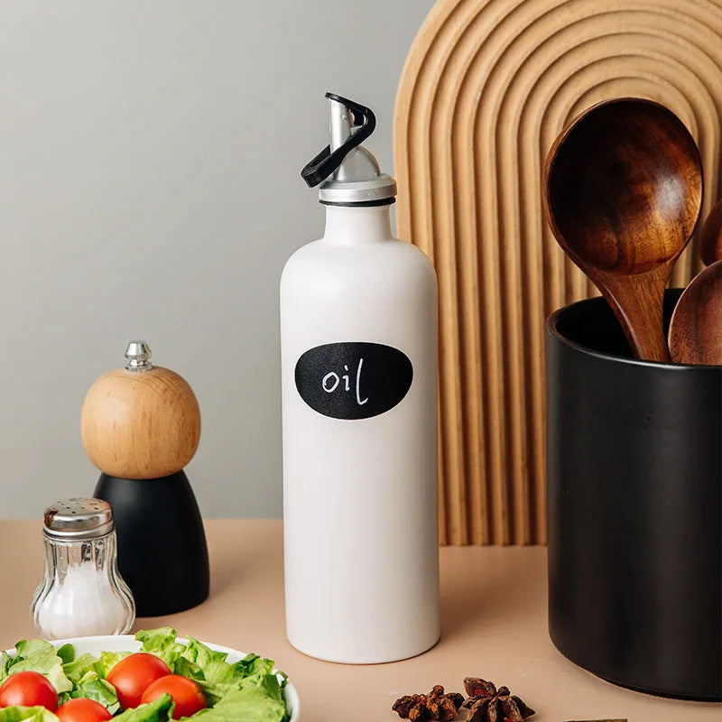 Ceramic oil pot with stainless steel funnel in black, coffee brown, or white finish.