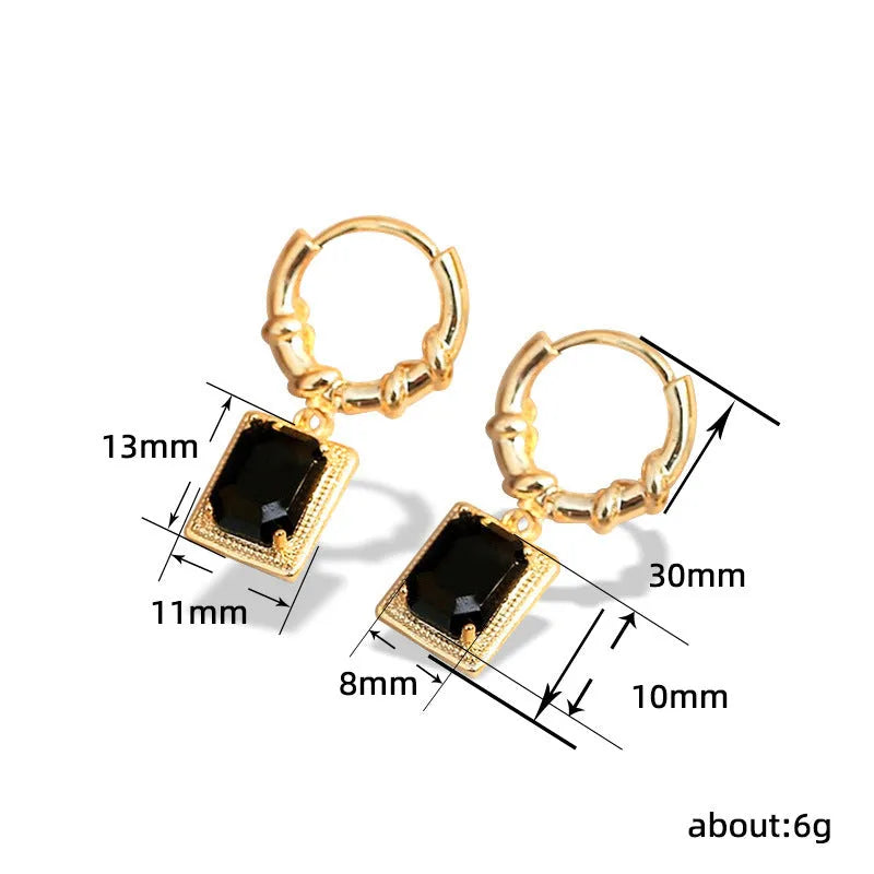 A pair of black geometric quadrilateral earrings with zircon accents on a copper base, retro French court style.