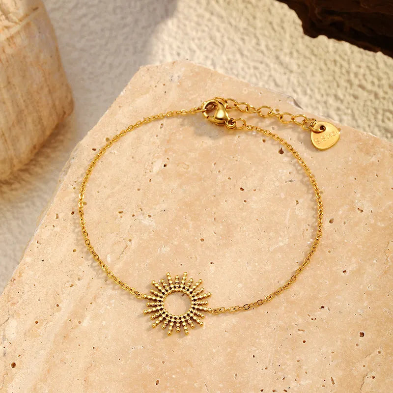 Sunflower Series women's gold-plated geometric chain necklace and bracelet set on a white background.