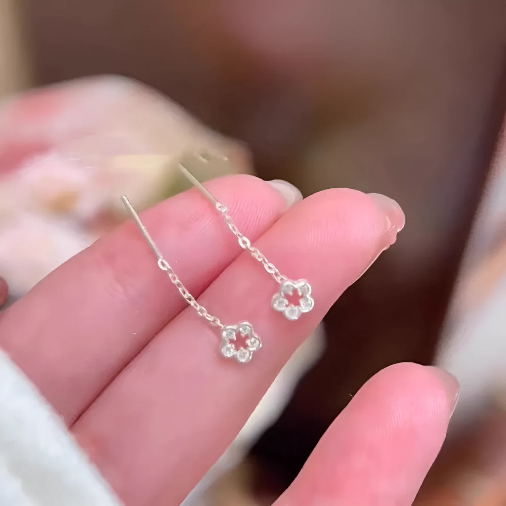 Sterling silver needle hollow flower hanging earrings with silver petal stud design