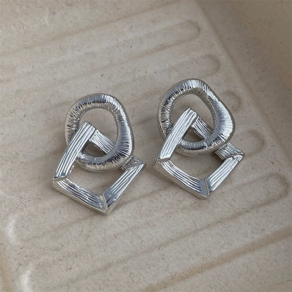 Retro geometric circle pendant earrings with 3.4 cm drop in electroplated gold or silver finish