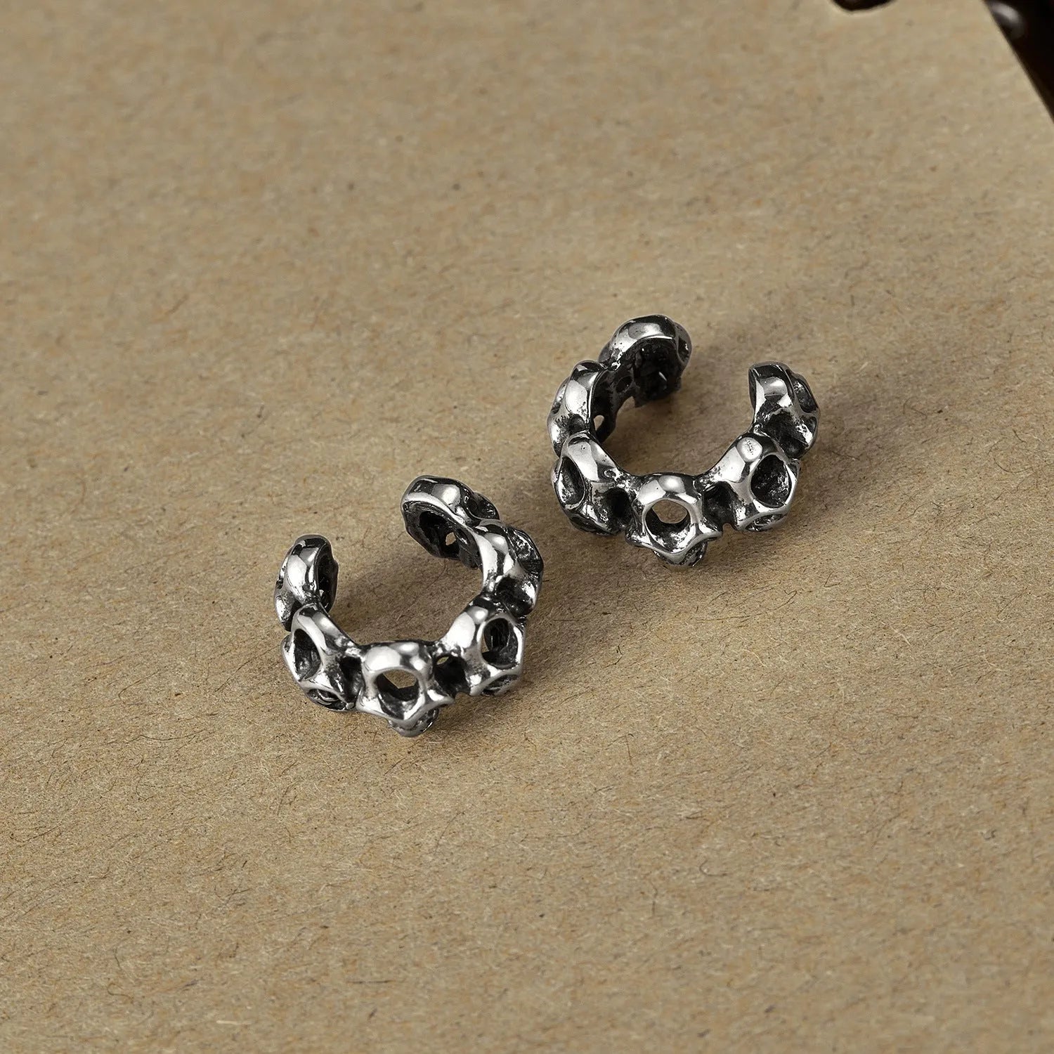 Retro hollow geometric skull earrings in stainless steel with ear clip fitting