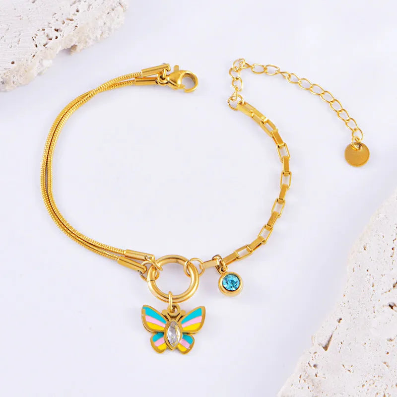 Gold epoxy butterfly necklace and bracelet set with titanium steel construction and zodiac animal pendant