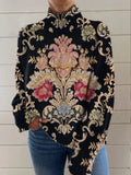 Black long sleeve turtleneck sweater with a raised 3D geometric pattern, shown on a model with a loose fit.