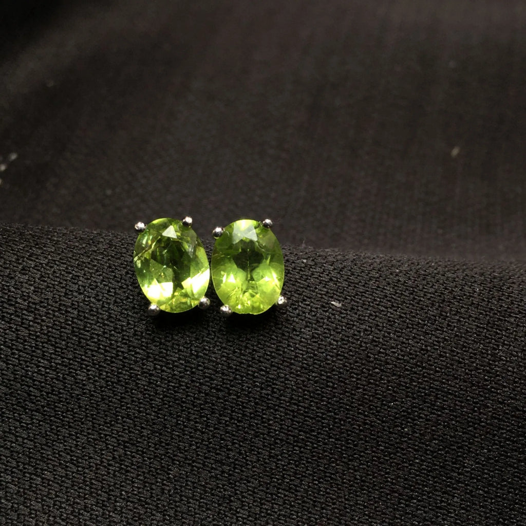Natural grass green olivine stud earrings in S925 sterling silver with 6x8mm oval stones.