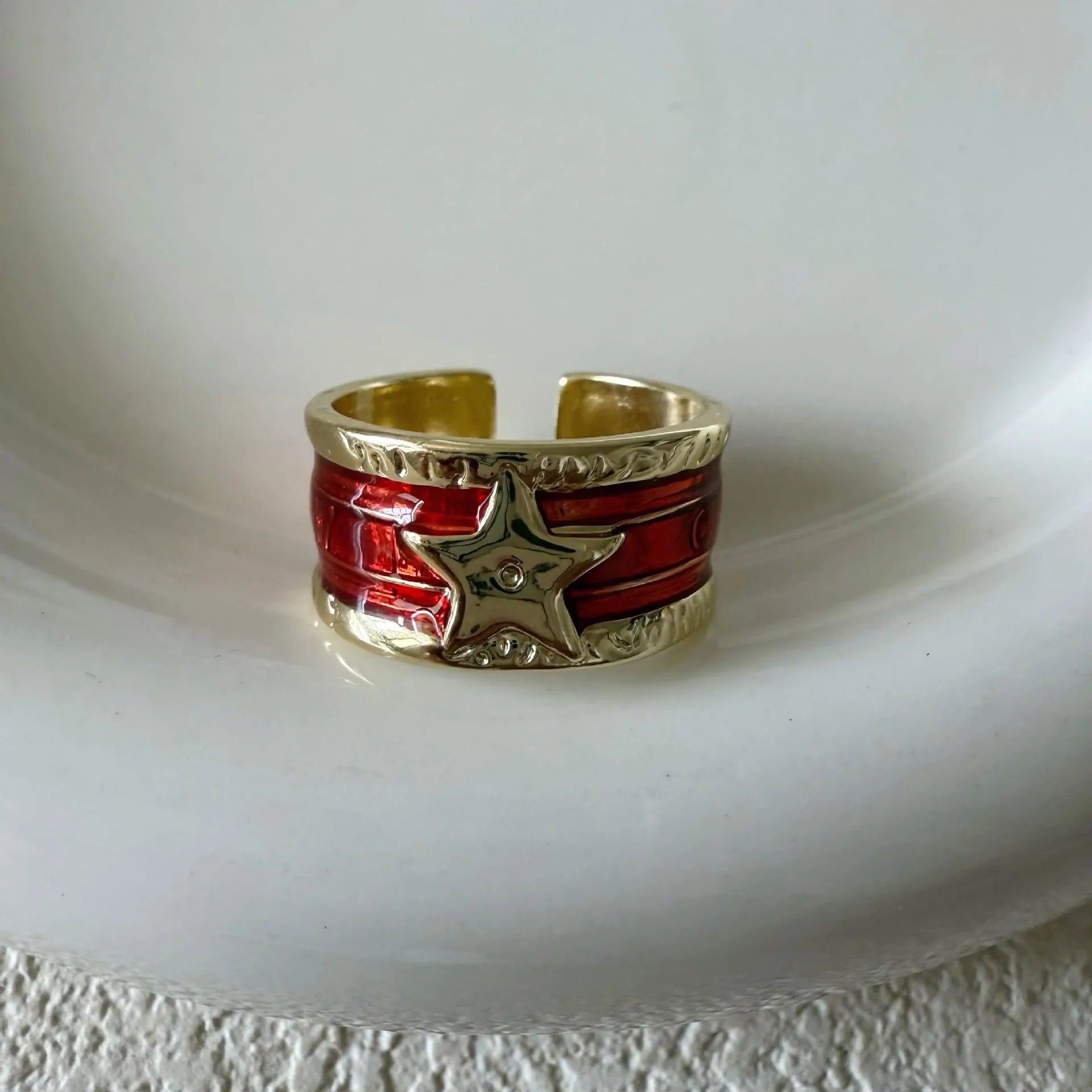 Geometric adjustable drop oil ring in copper with electroplated finish and linear detailing