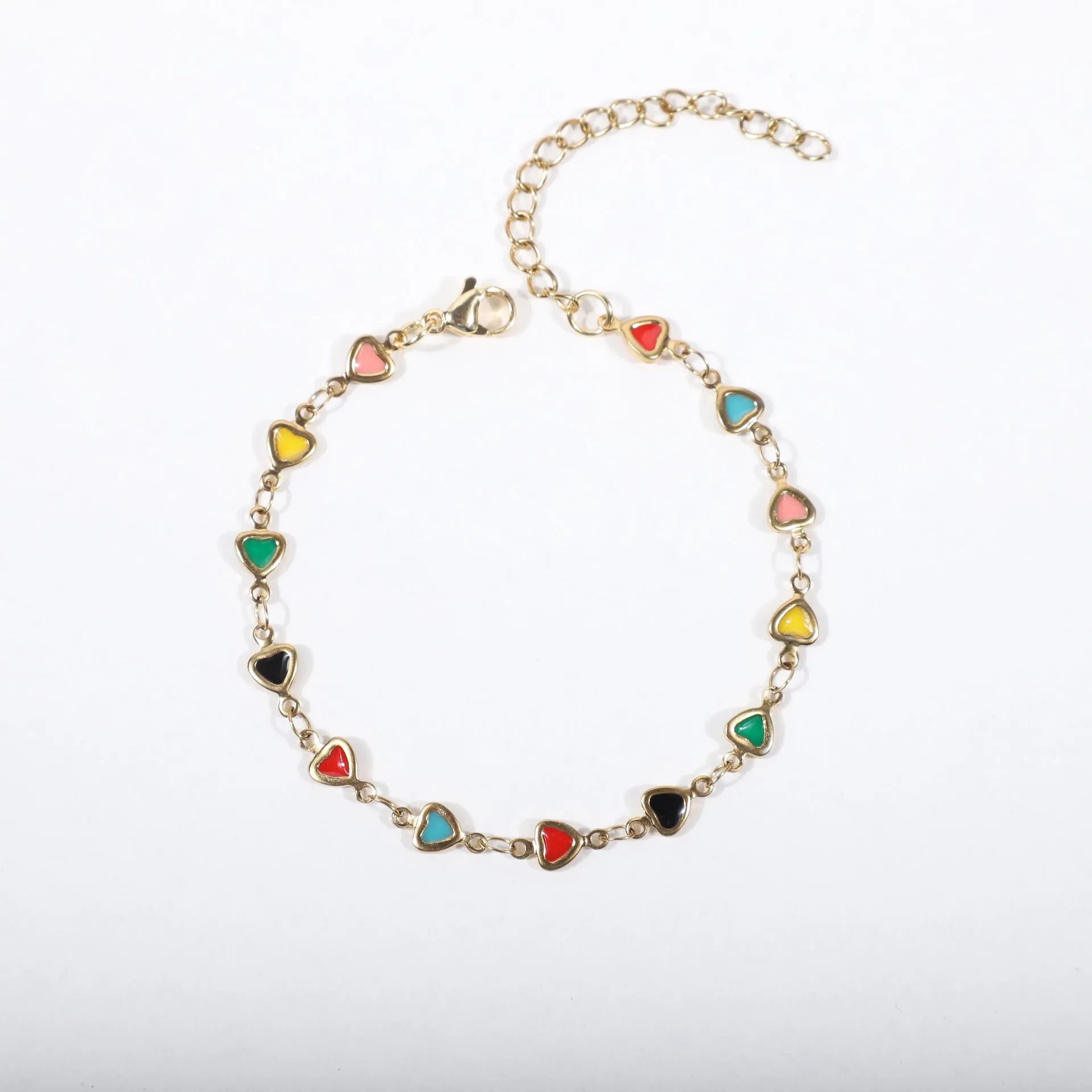 Stainless steel heart-shaped bracelet with gold plating in multiple colour options on a wrist.