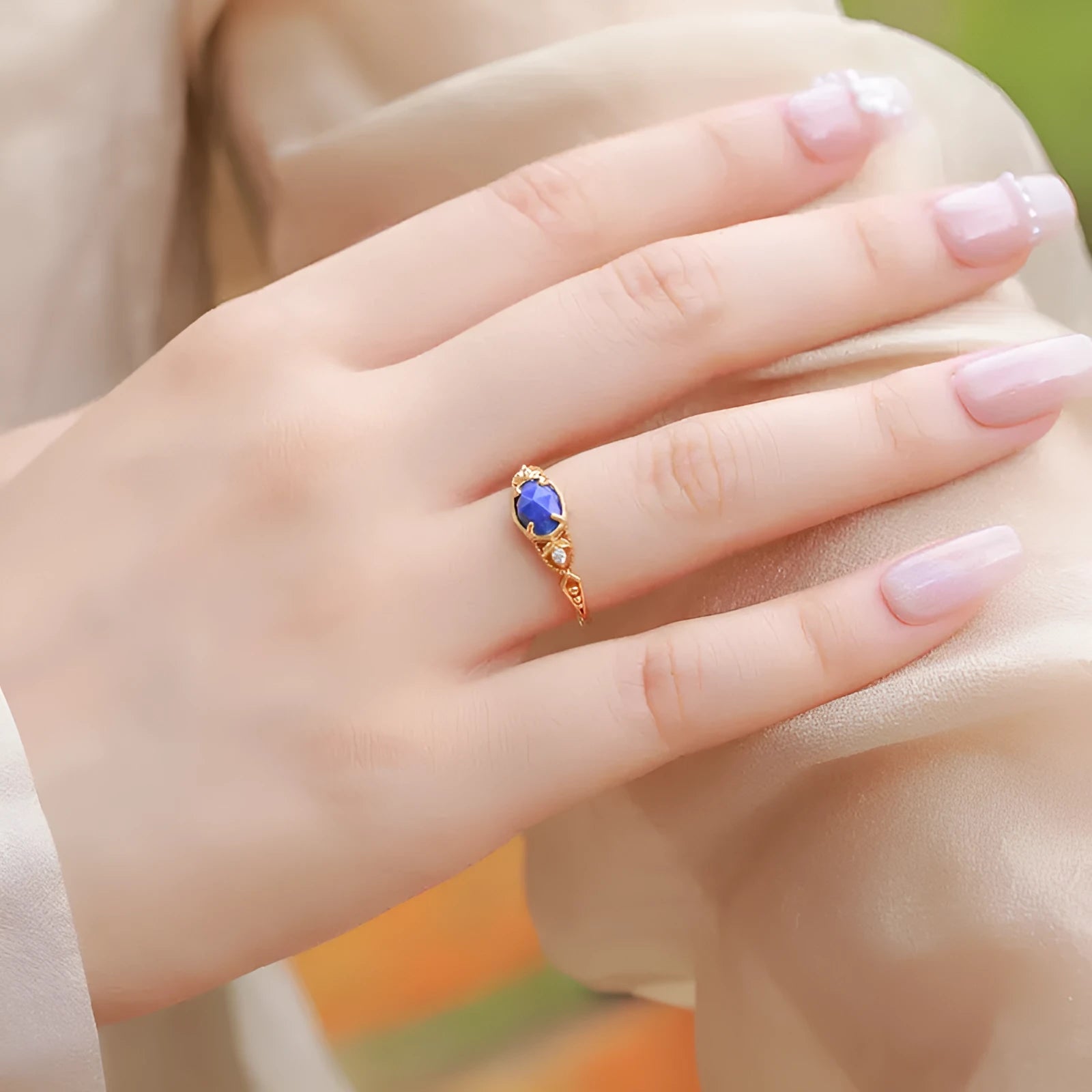 Women's silver geometric ring with blue lapis lazuli stone in ellipse shape