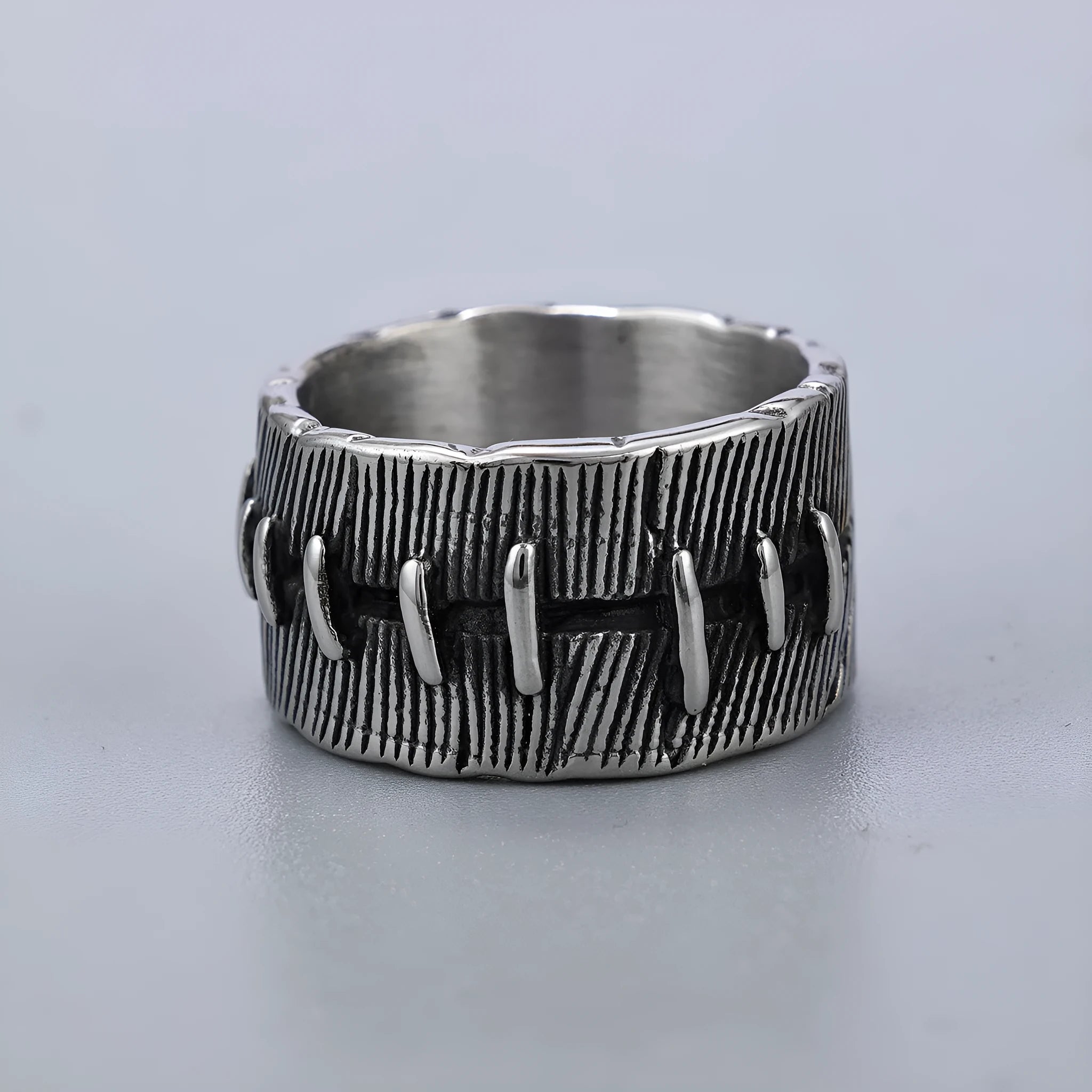 Dark punk style titanium steel ring with stitched geometric U-shape double ring design in retro colour.