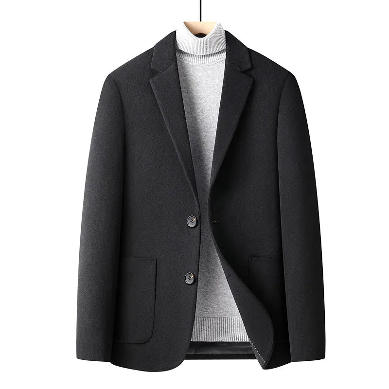 Men's slim fit wool suit jacket in grey on a hanger, showing notch lapel and button front.