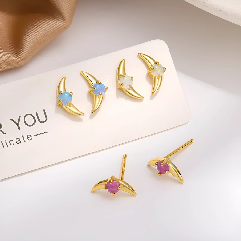 Geometric shaped 925 silver earrings with gold plating and a blue stone.