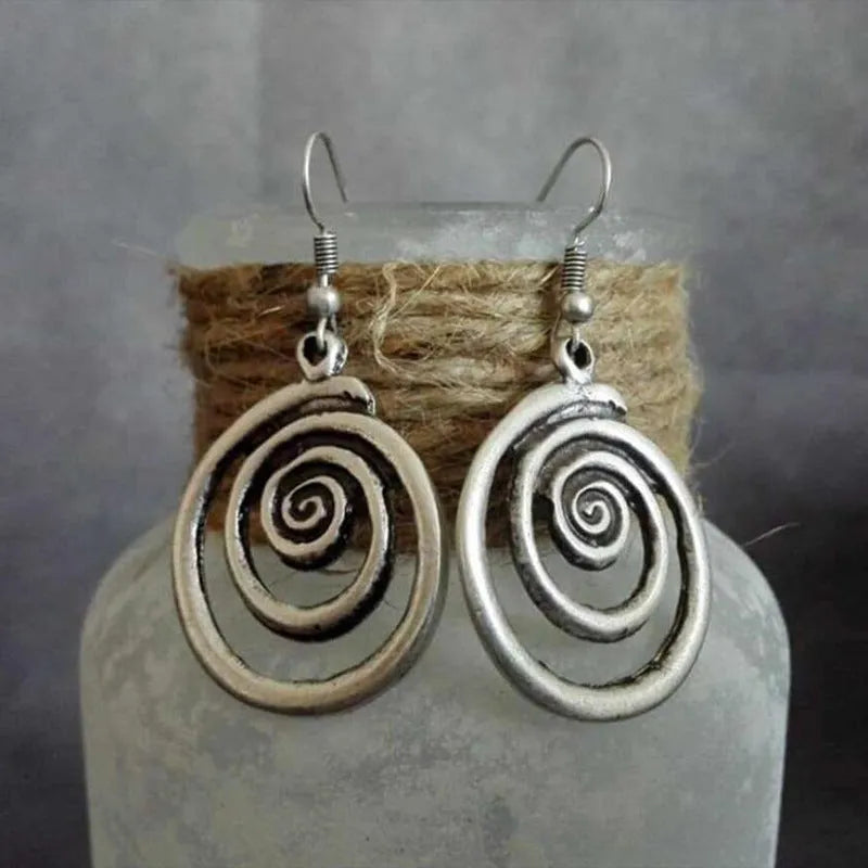 Silver geometric spiral distressed earrings with national style design measuring 2.6x5cm