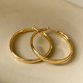 Circular 40mm diameter metal earrings with gold or silver electroplated finish