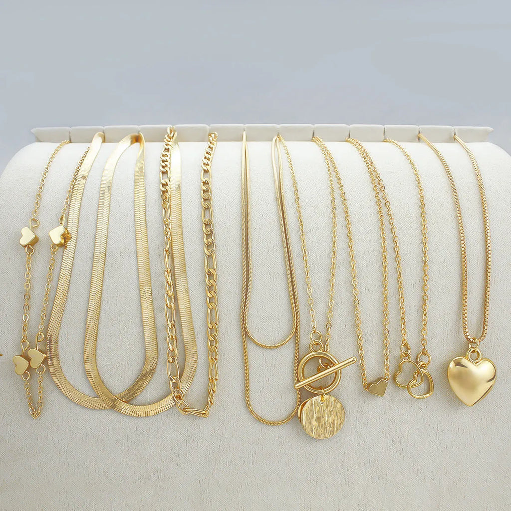 10-piece gold electroplated women's necklace set with adjustable length and snake bone chain design
