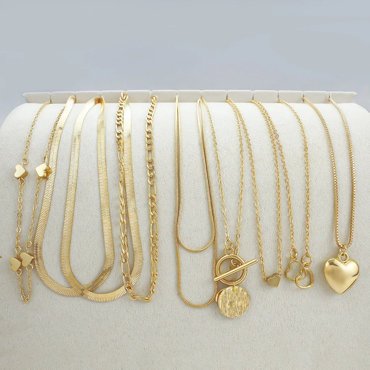 10-piece gold electroplated women's necklace set with adjustable length and snake bone chain design