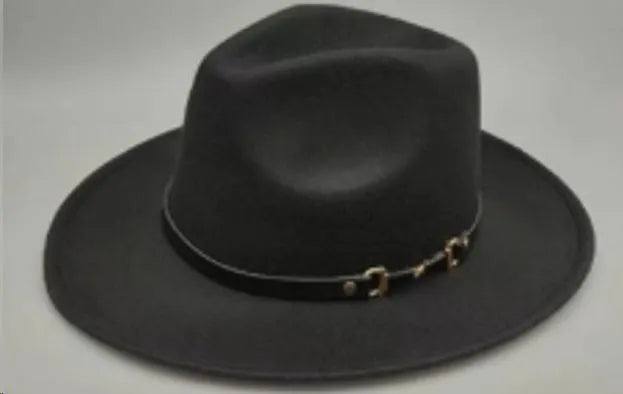 Brown leather velvet cowboy hat with a curved edge and conical crown on a plain background.