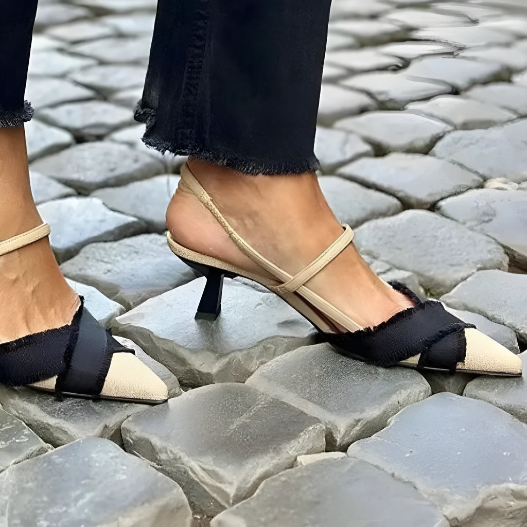 Women's apricot and black colour block stiletto sandals with a buckle fastening and pointed toe.