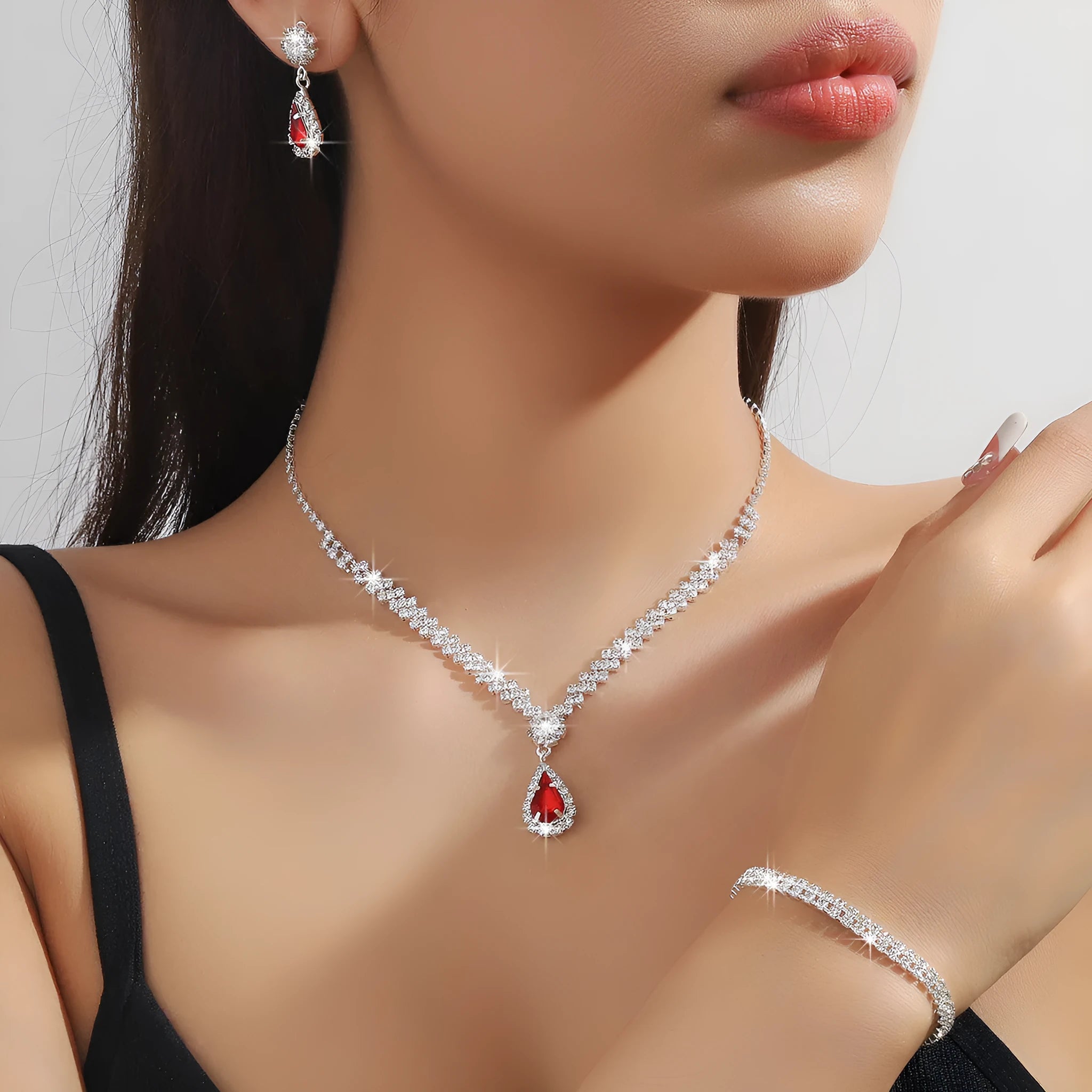 Claw chain necklace and earrings set with drop-shaped rhinestones in choice of five colours