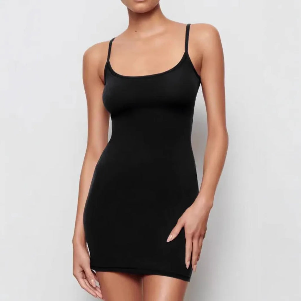 Black sleeveless sling dress with skinny sheath silhouette and solid colour