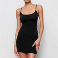 Black sleeveless sling dress with skinny sheath silhouette and solid colour