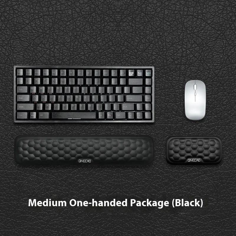 Customisable memory foam mouse wrist pad with black cloth cover on a desk.