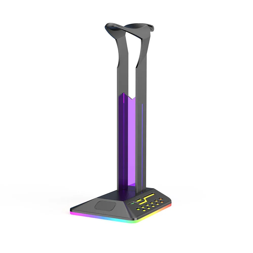 RGB colour-changing headphone display bracket with integrated dual USB ports on a desk.