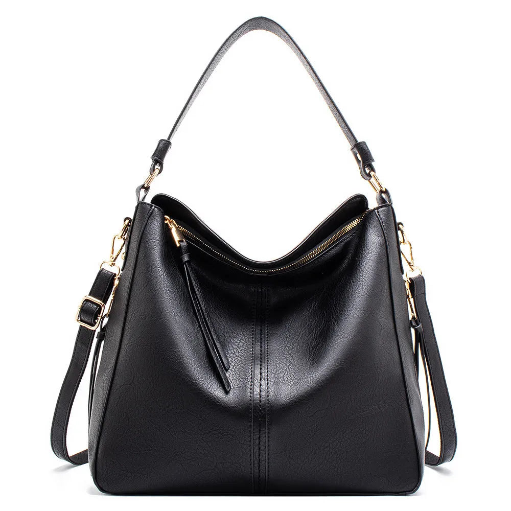Large capacity PU hobo bag for women with zip closure, internal pockets, and soft handles in solid colour