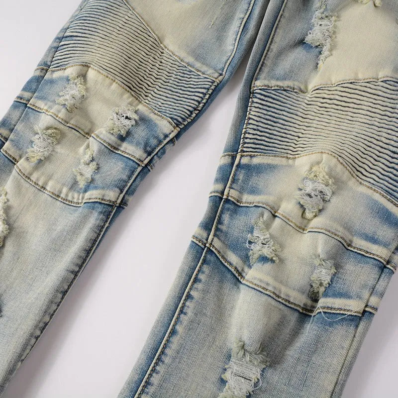 Light blue men's slim stretch jeans with hand-frayed distressed details and a straight leg.