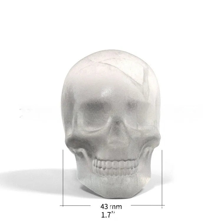 3D Halloween skull-shaped silicone ice cube tray on a white background.