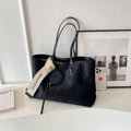 Large polyester shoulder tote bag in horizontal square shape with zipped compartment and sandwich pocket