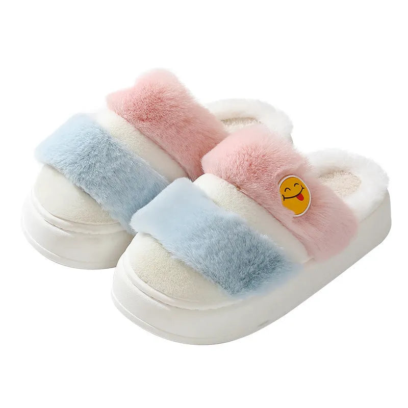 Pink and green thermal cotton slippers with plush upper and non-slip sole.