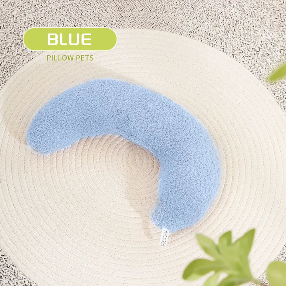 U-shaped blue cat pillow with adjustable collar for cervical support on a sofa