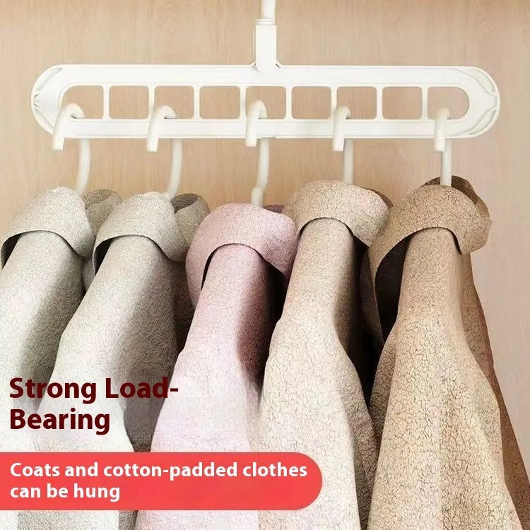 Green plastic nine-hole folding pant hanger for trousers and skirts.