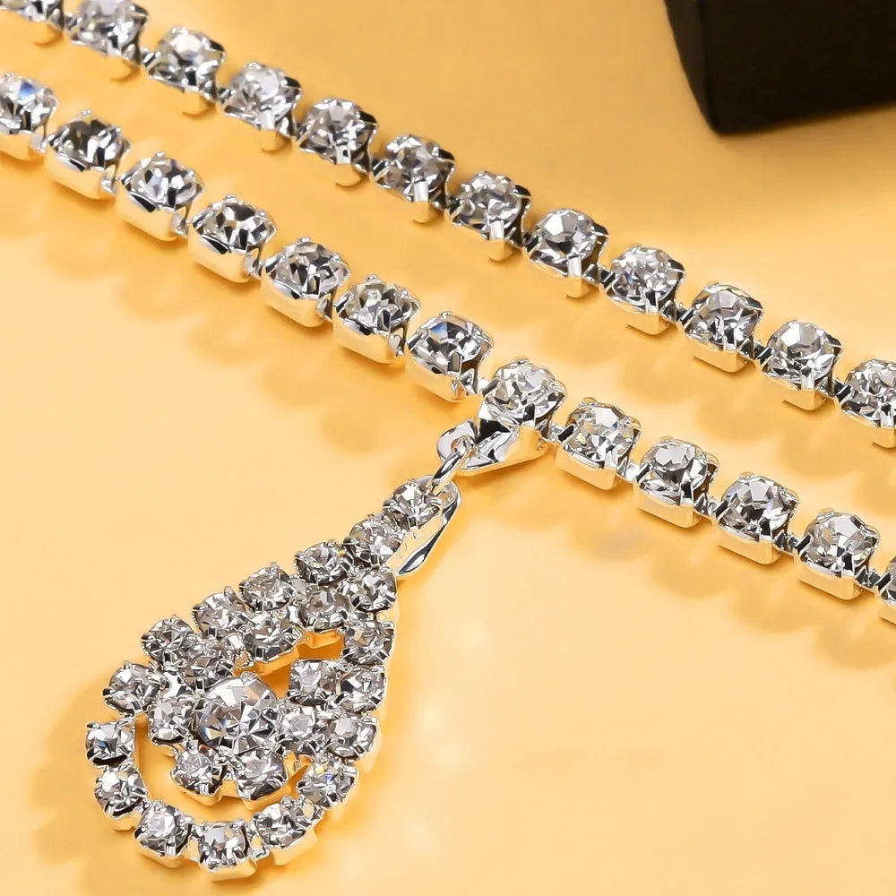 Gold waist chain with water drop rhinestone pendant and lobster buckle closure