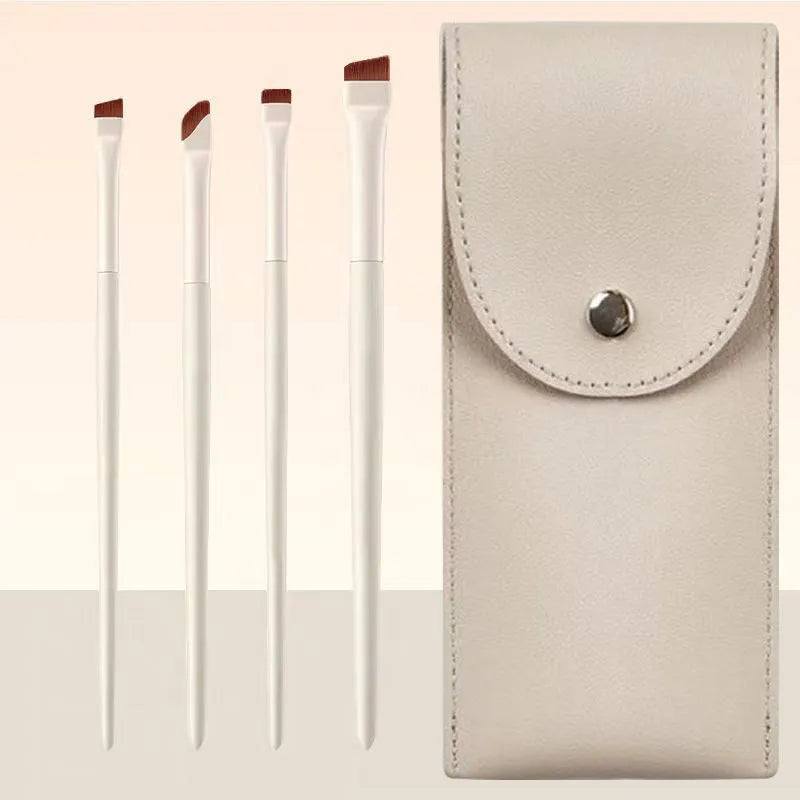 Four angled eyeliner and brow makeup brushes with ultra-thin tips in a leather case.