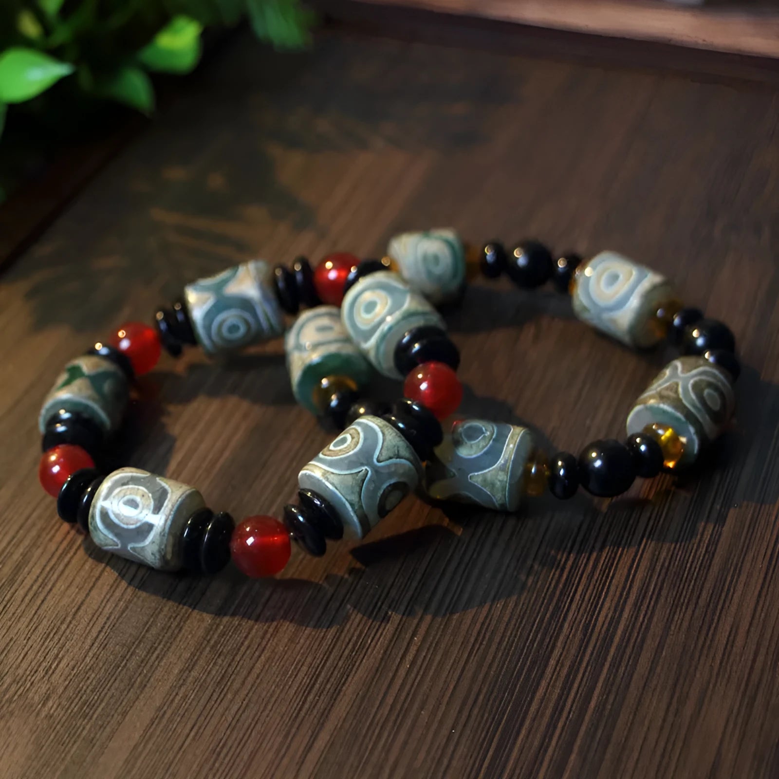 Agate Tibetan dzi bead bracelet with three-eye design and polished finish
