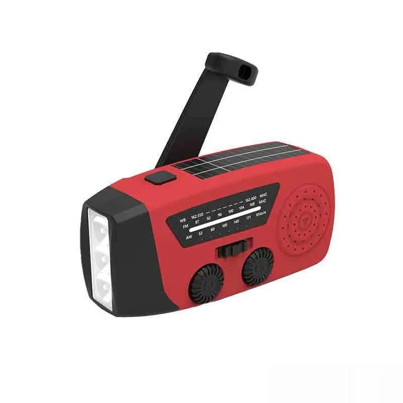 Red rechargeable emergency hand radio and LED torch with wrist strap on a white background
