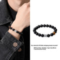Men's obsidian and pure silver bracelet with a 10mm mantra prayer wheel bead.