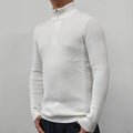 Man wearing a grey half-turtleneck zipper sweater, a cotton blend pullover for casual wear.