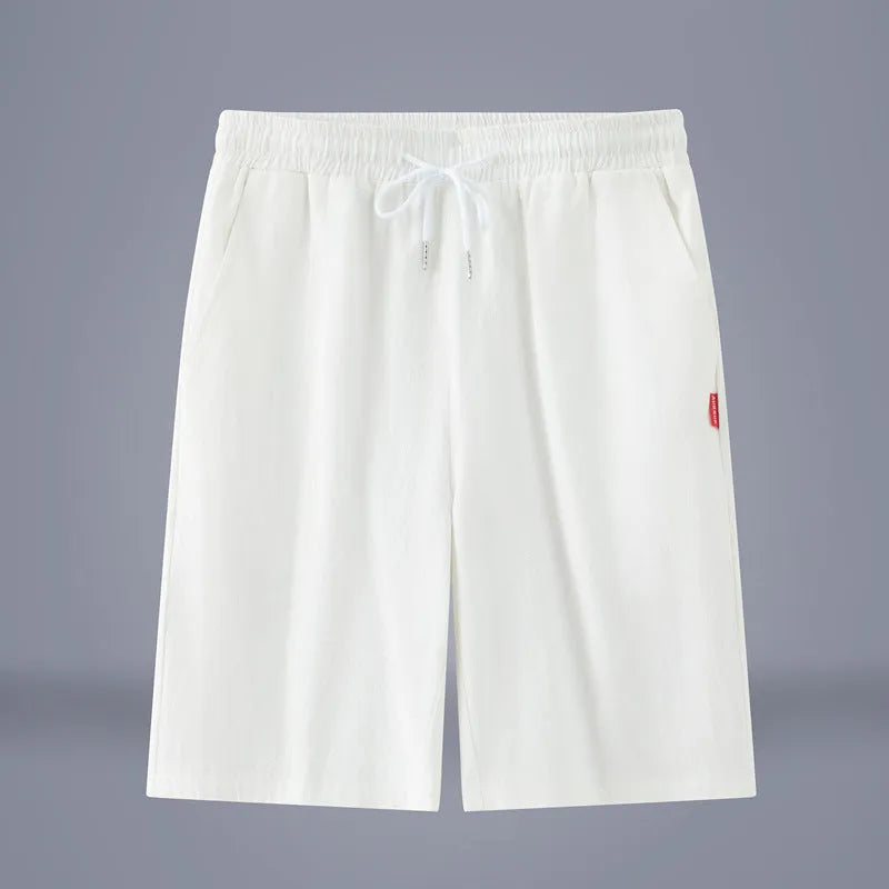 Solid colour cotton linen cropped summer pants with a drawstring waist on a hanger.
