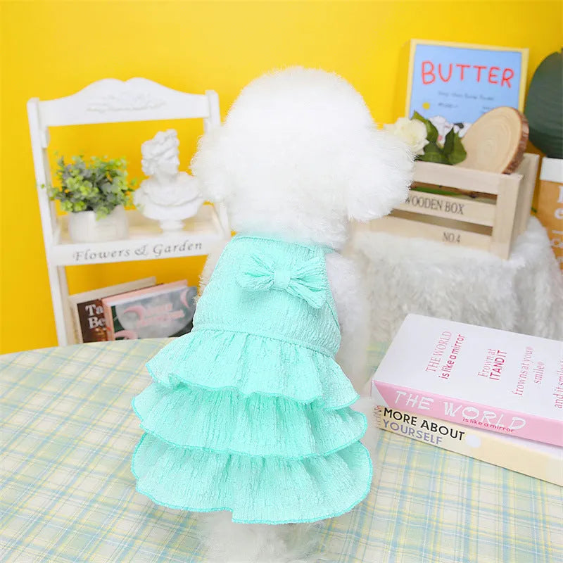 Small dog wearing princess dress with layered skirt in polyester fabric