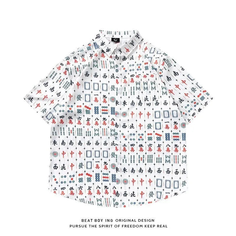 Loose fit short sleeve shirt with all-over floral print, cardigan style, in a polyester fabric.