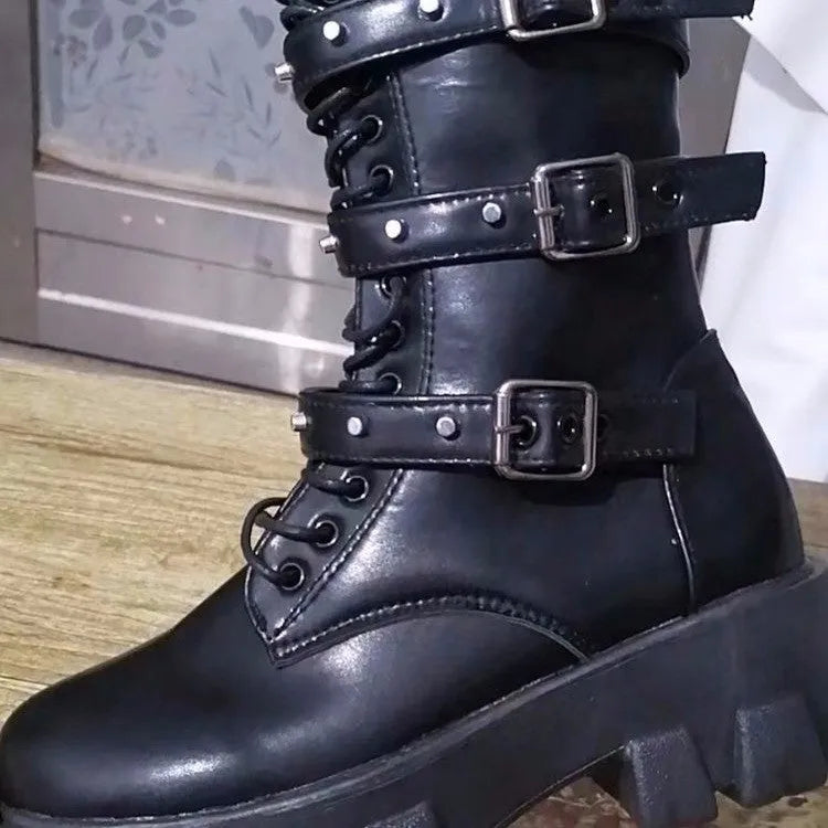 Women's black mid-calf knight boots with a side zip and metal buckle detail on the shaft.