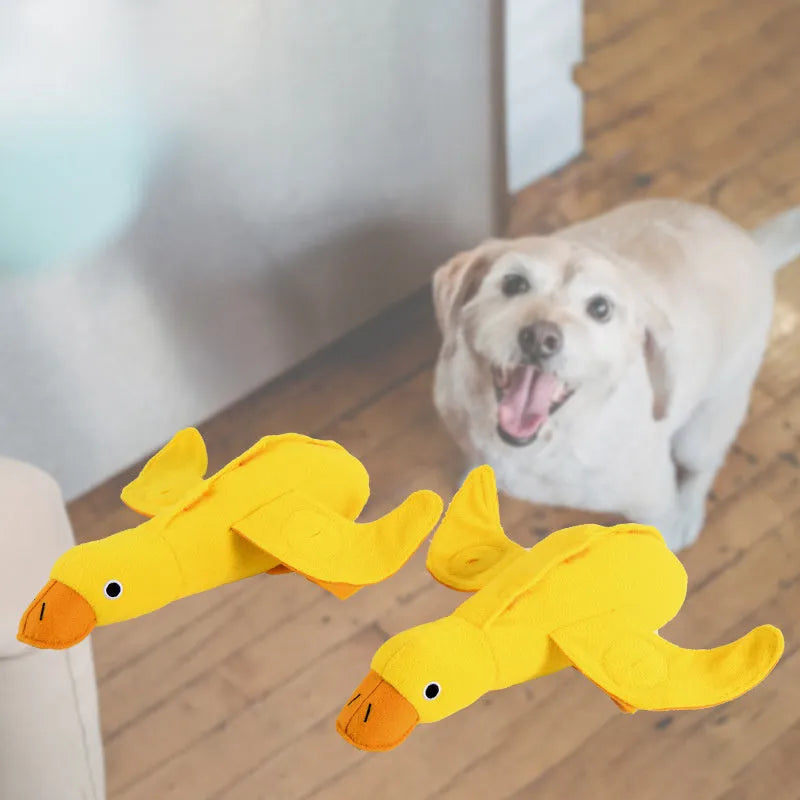 Yellow teddy dog toy with integrated duck doll, a pet training aid with sound and treat dispenser.